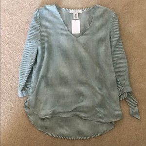 Green and white striped blouse